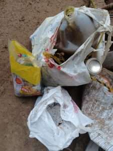 Birds-eye view of three bags of trash picked up at the Pacific Flyway Shorebird Survey