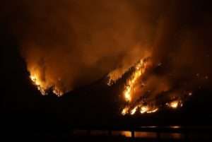 Nighttime photo showing part of the Columbia Gorge burning for fireworks harm nature article